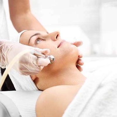 Relaxed woman during a microdermabrasion treatment in beauty salon